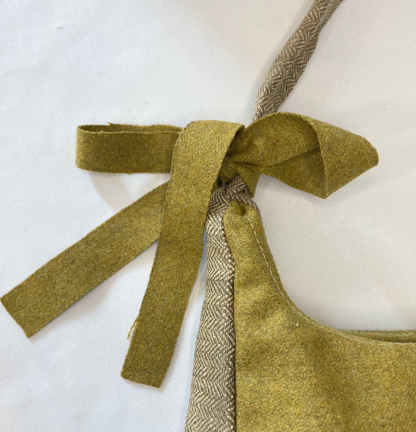 Green bag with herringbone details