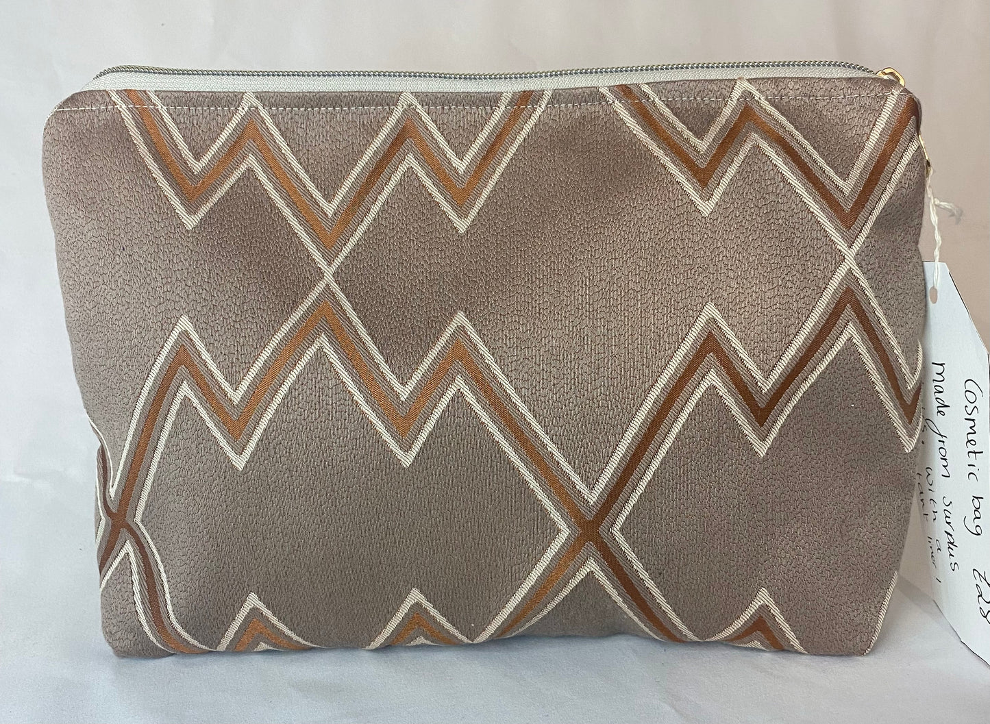 Brown Cosmetic bag with water resistant lining