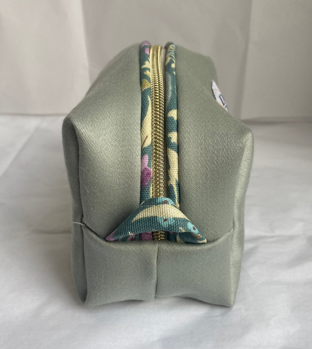Green with floral piping Mini pouch