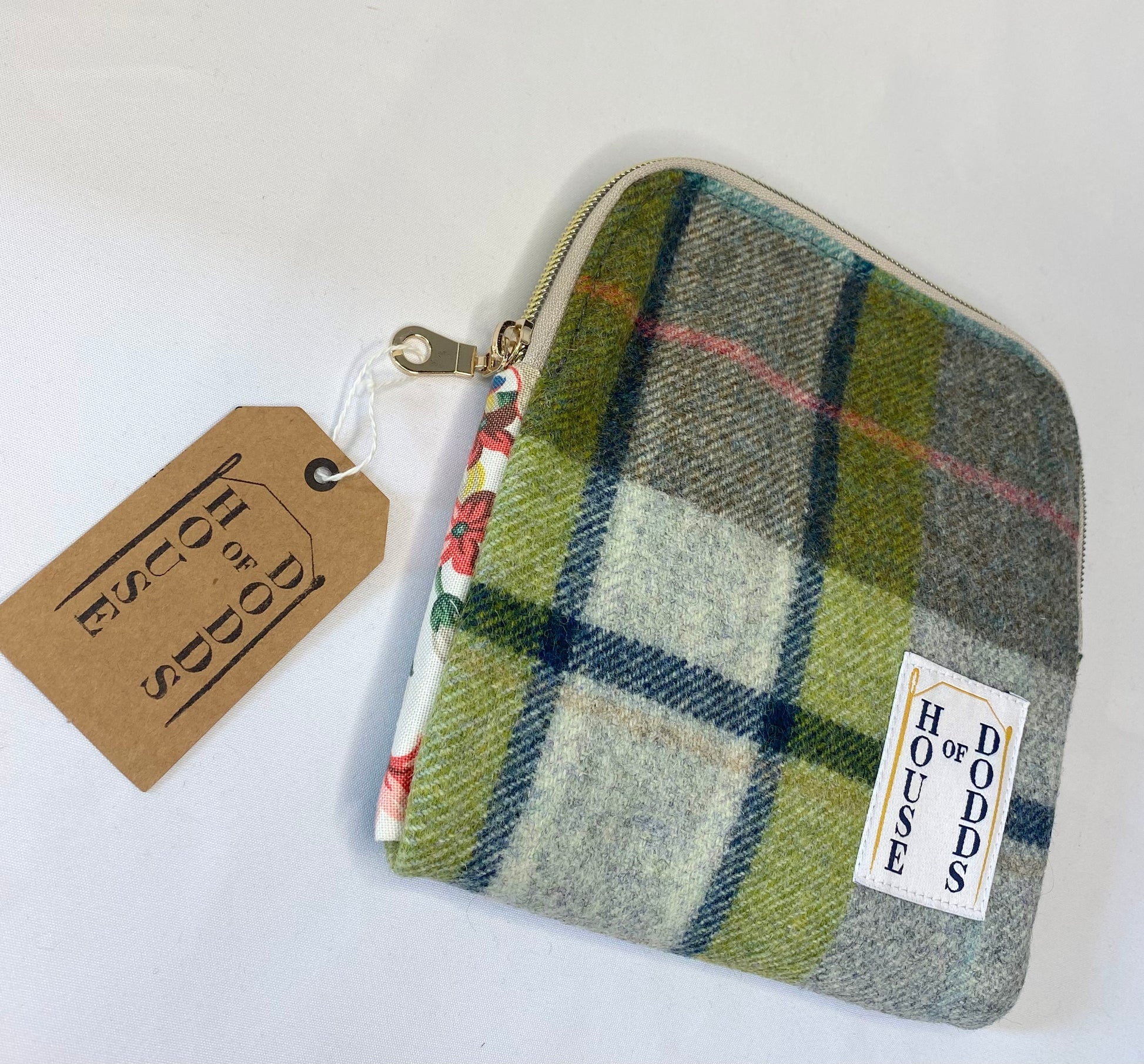 Plaid pouch with a visible brand tag on a white background